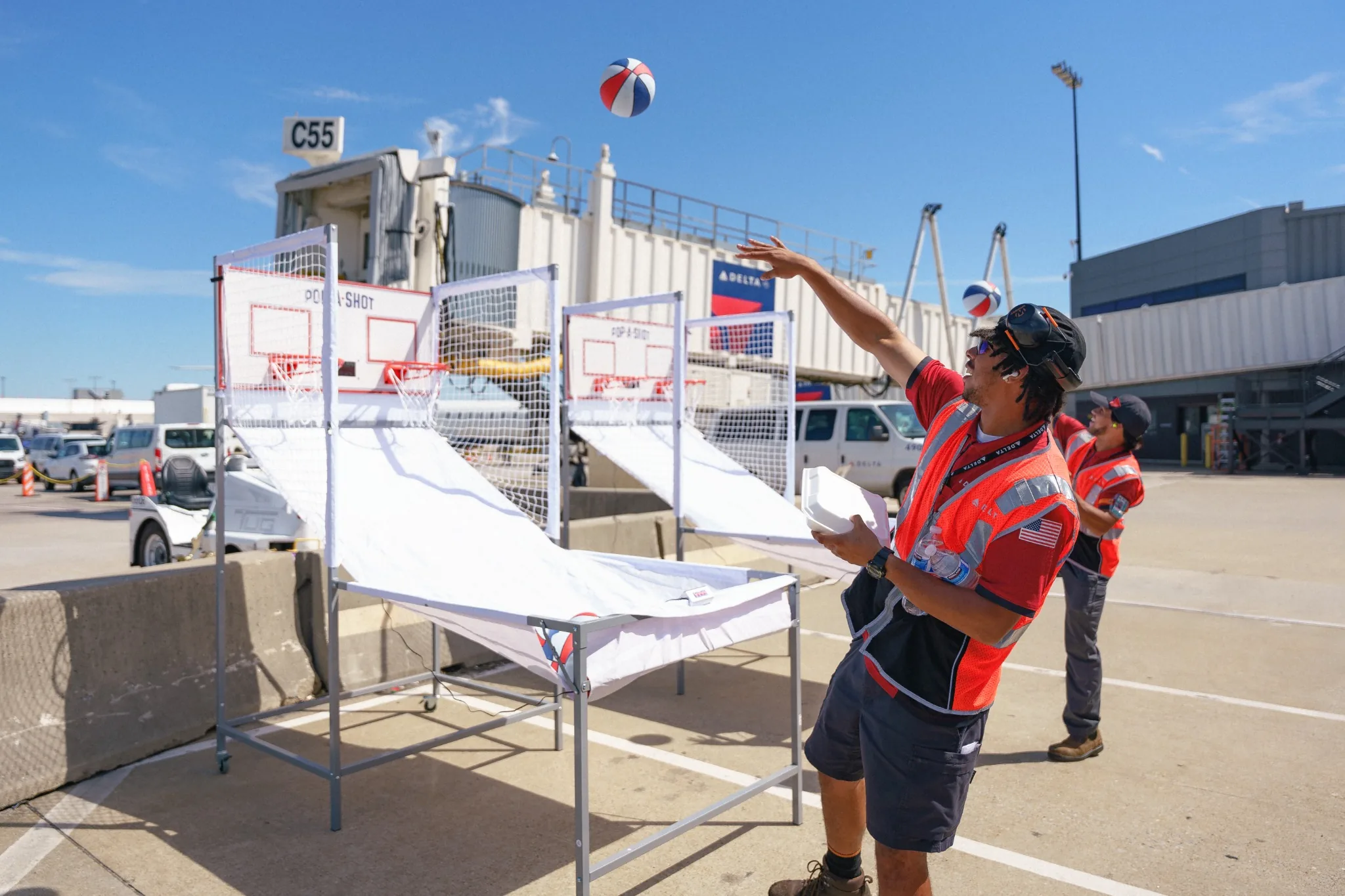 Delta Air Lines branded pop-a-shot activation at an airport event