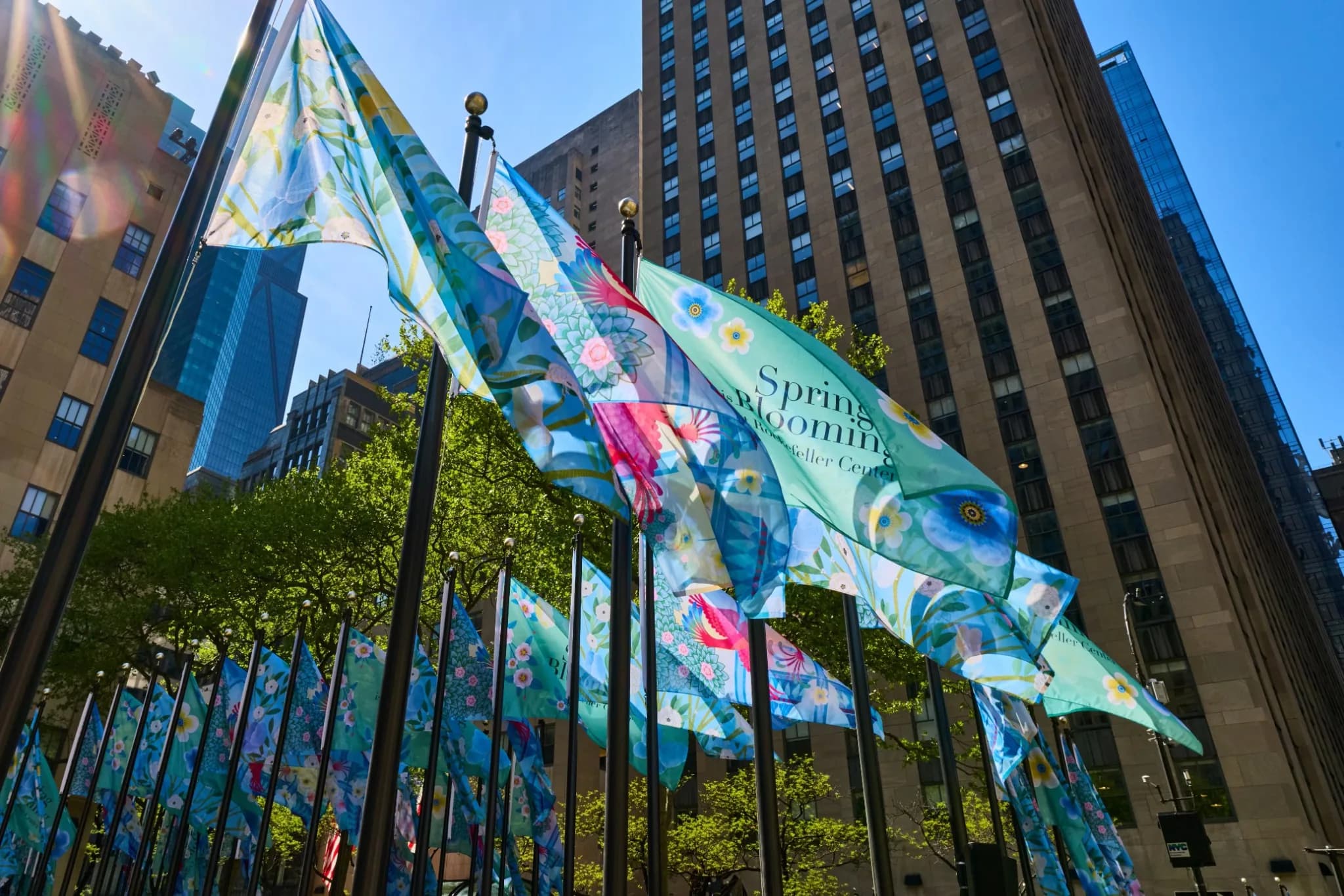 Van Cleef & Arpels Spring Is Blooming flags at Rockefeller Center